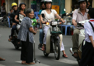 crossing a street in Ho Chi Minh City