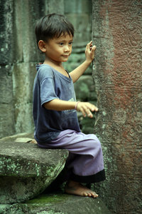 cute little boy playing by himself at Preah Khan
