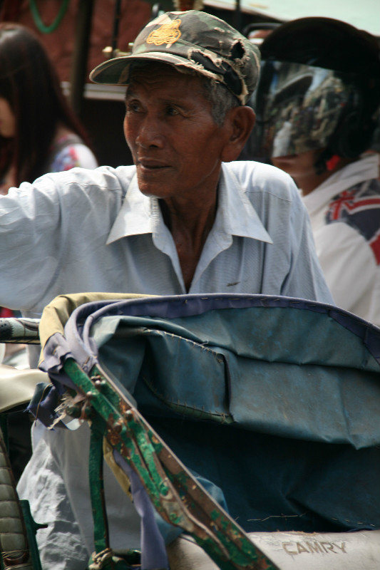 one of many cyclo drivers in Phnom Penh