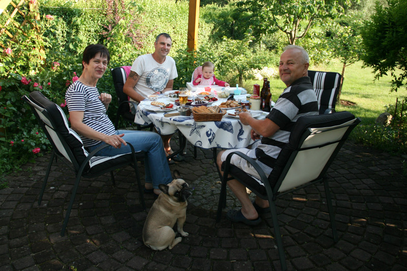 Family afternoon, having a little snack in the garden