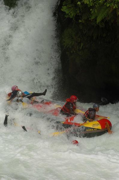 Kez getting saved by the guide at the back of the raft at the bottom of the falls