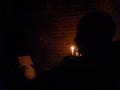 Leigh trying Sudoku by candlelight