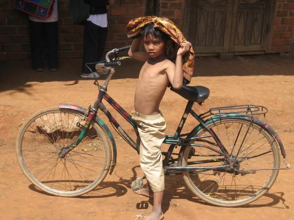 Little boy on a big bike