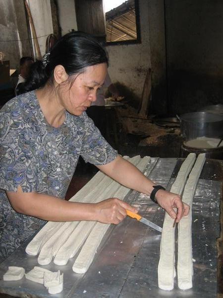Woman making tofu