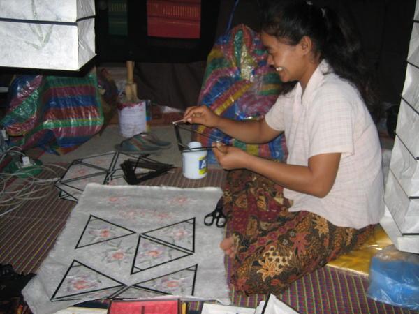 Woman making paper lanterns