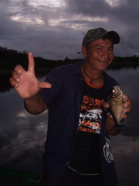 my guide with his pirahna catch