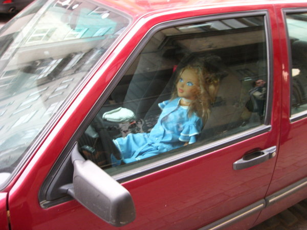 Doll in car