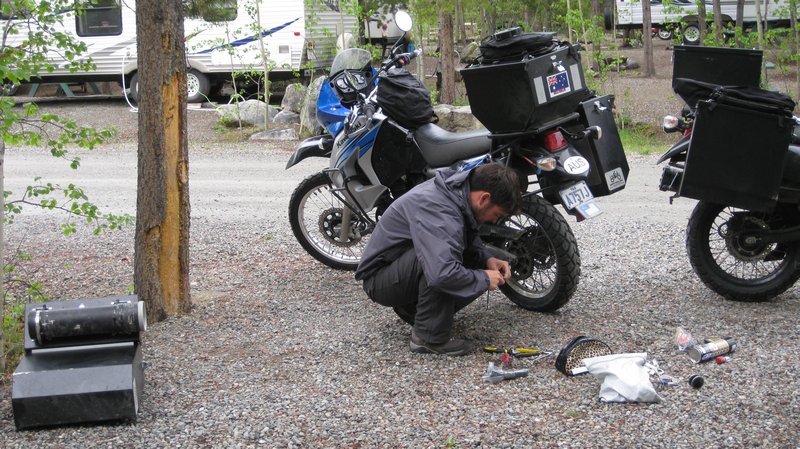 Adam fixing the bike