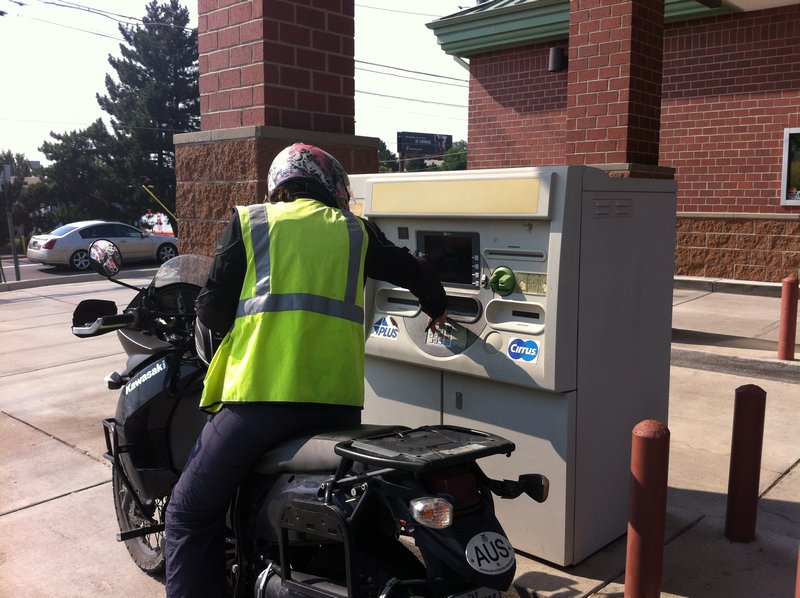 Kenz using a drive-thru ATM