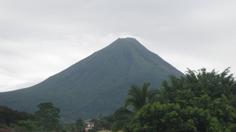 Arenal volcano out from behind the ever-present clouds