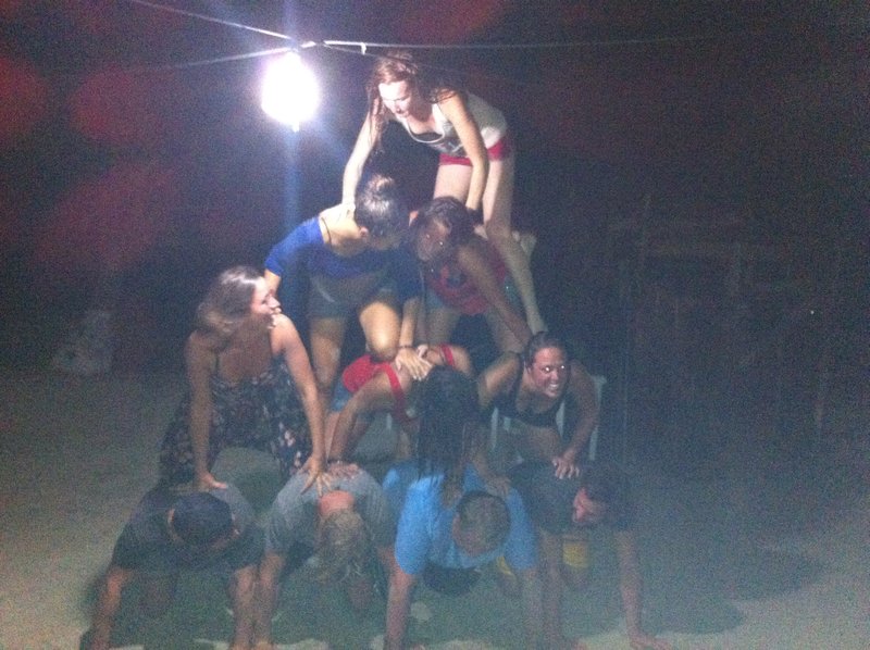 The passengers attempt a human pyramid after drinking too much rum