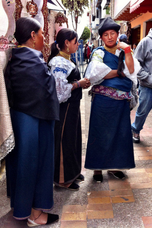 Traditionally dressed women at the Otavalo market