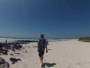 Zac walking along Tortuga Bay beach