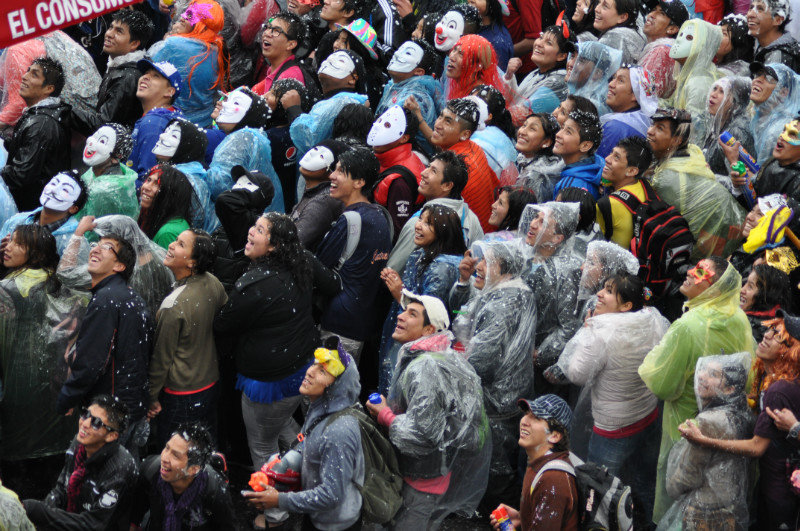 La Paz Carnaval crowd realising where the bucket of beer was thrown from