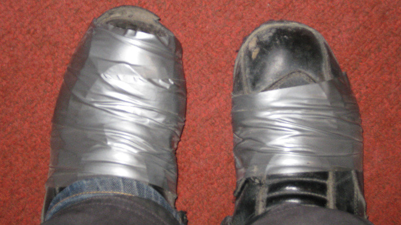 The transition of Kenz's bike boots to space boots, as they start to fall apart