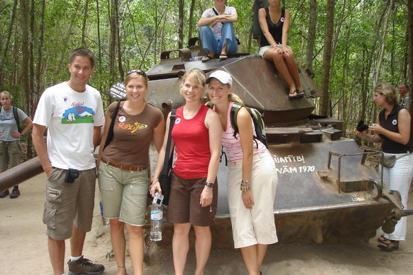 The four of us posing in front of an American tank