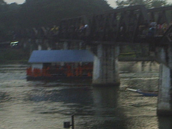 A raft of Buddist monks travelling along the river Kwai