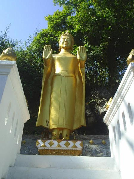 Golden Buddha on the way down Phu Si
