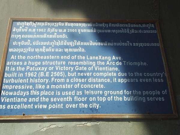 Sign on the side of the Patuxay monument