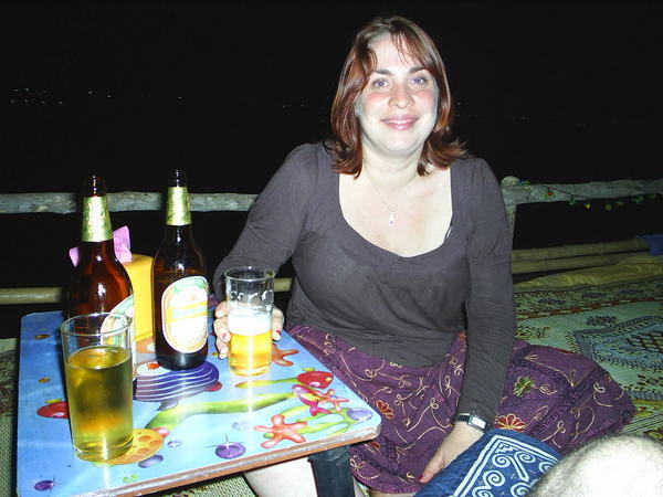 Having dinner on the banks of the Mekong