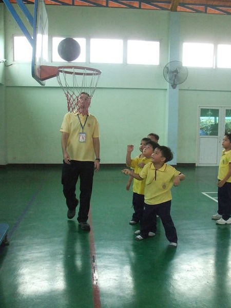 Kris teaching basketball