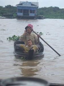 Woman and her baby selling bananas from the boat