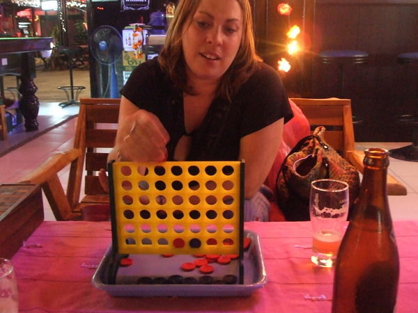 Kate failing to beat Kris at Connect 4