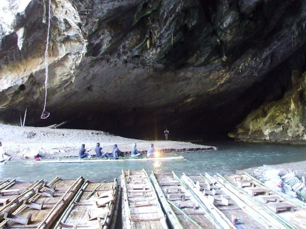Bamboo raft entering Tham Lot cave