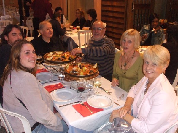 The family enjoying paella 