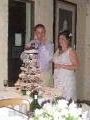 Paul and Sarah cutting the cake