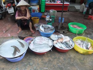 Woman selling fresh fish
