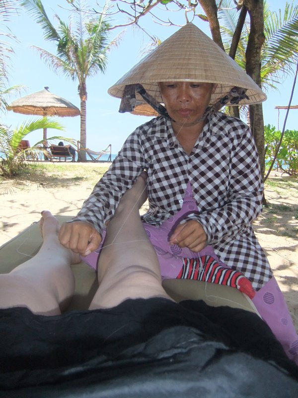 Having my leg hair removed with cotton