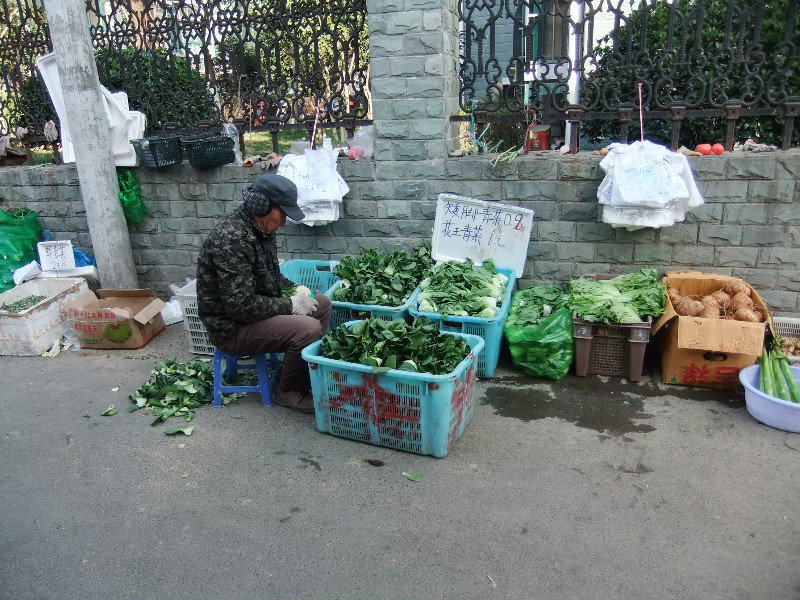 Cold man selling vegetables.