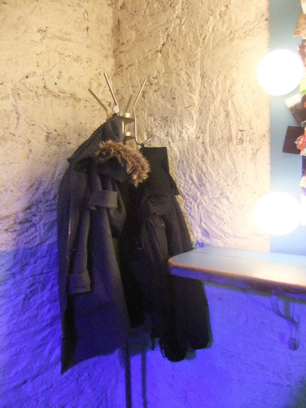 Coat hanging in a bar