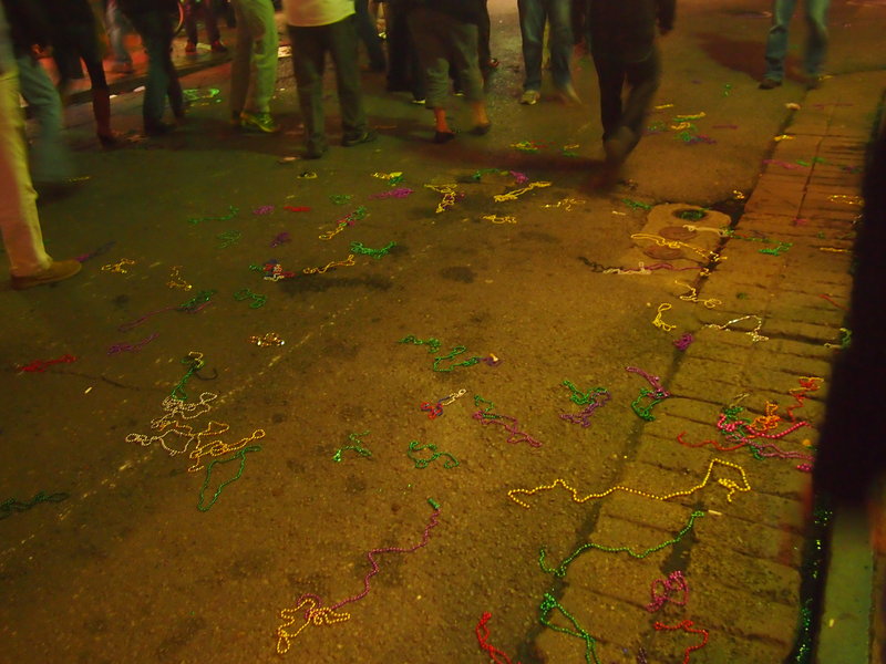 Mardi Gras beads on floor