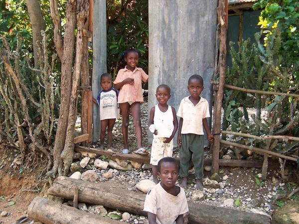 Haitian children, wondering what was going on as we hiked past their house. 
