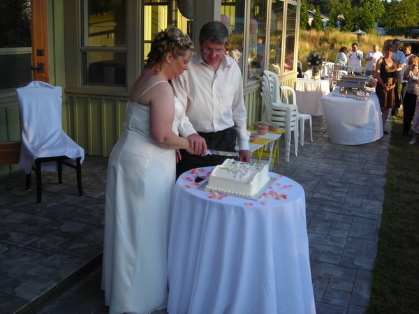 Gilbert and Debbie Cutting the Wedding Cake.