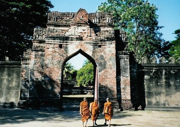 monks at ruins