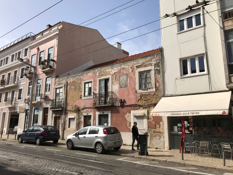 A typical Lisbon street showing modern (R), run down (C) and restored (L) buildings