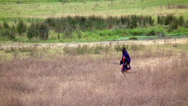 Masai man crossing 