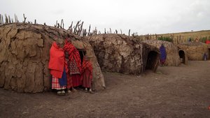 Women with kids in their huts