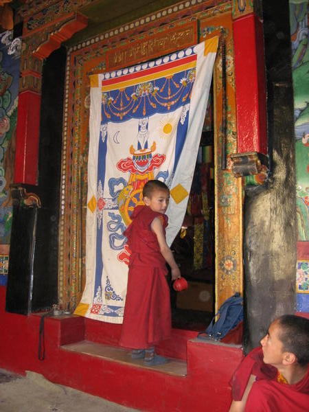 Little Tsering Puntso entering Spitok Gompa's main building