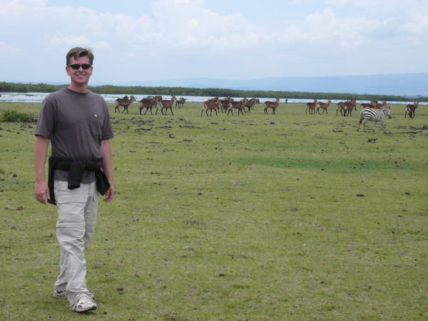 Scott with waterbucks and zebras