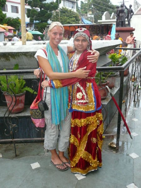 Being made to pose (they put me like this!) with a girl in traditional costume!