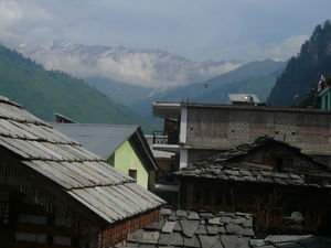 Snowy mountains with the temple roof in the foreground, Vashisht