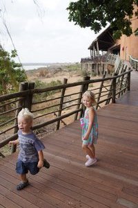Playing on the boardwalk with Lower Sabie Camp's stunning restaurant in the background