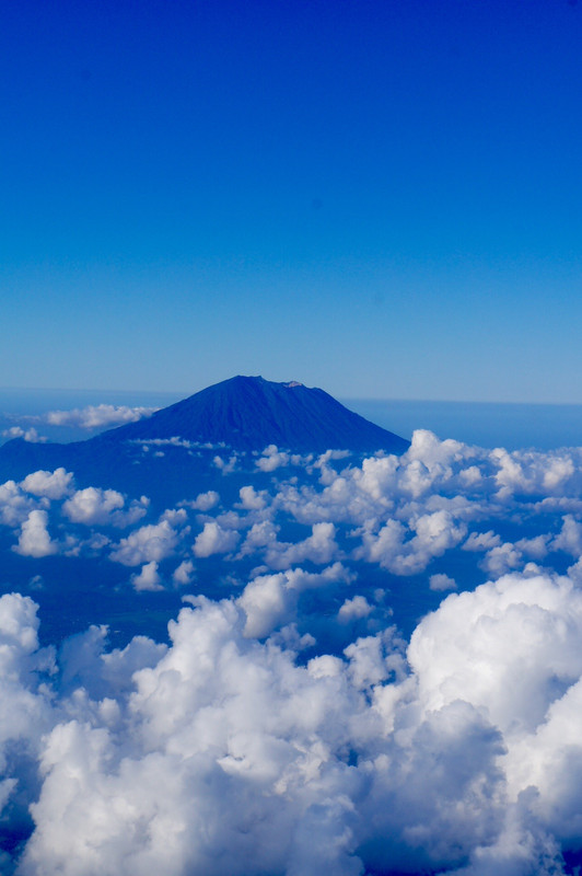 Mt Ganung Agung, Bali's highest mountain, peeking up through the clouds.