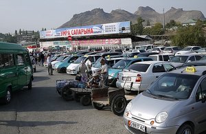Car park for the bazaar, and mountain behind
