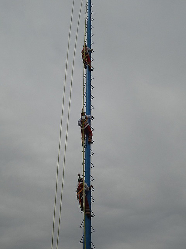 Climbing to the top of a tall pole