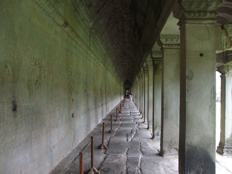 Carvings run ell the way down, all around the site -Angkor Wat